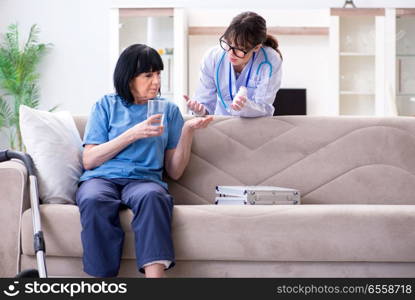 The young doctor visiting old mature woman for check-up. Young doctor visiting old mature woman for check-up