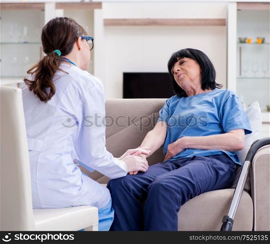 The young doctor visiting old mature woman for check-up. Young doctor visiting old mature woman for check-up