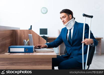 The young employee after accident in the office. Young employee after accident in the office