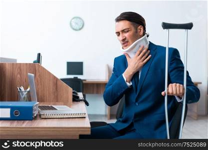 The young employee after accident in the office. Young employee after accident in the office