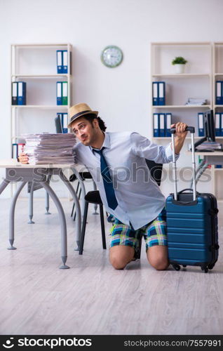 The young employee escaping for summer vacation. Young employee escaping for summer vacation