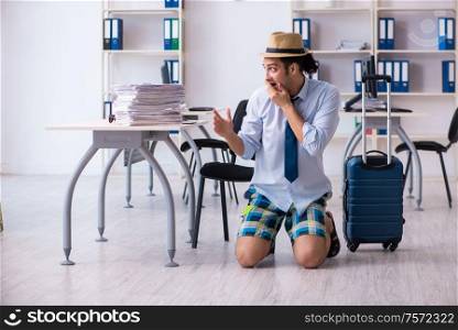 The young employee escaping for summer vacation. Young employee escaping for summer vacation