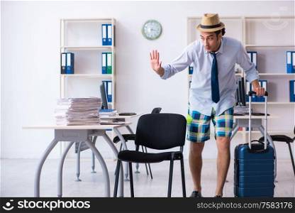 The young employee escaping for summer vacation. Young employee escaping for summer vacation