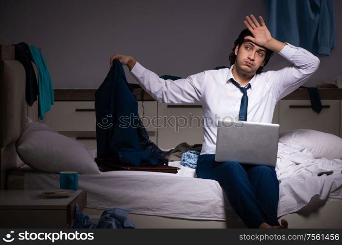 The young employee working at home after night shift. Young employee working at home after night shift