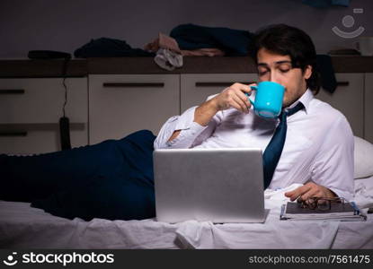 The young employee working at home after night shift. Young employee working at home after night shift