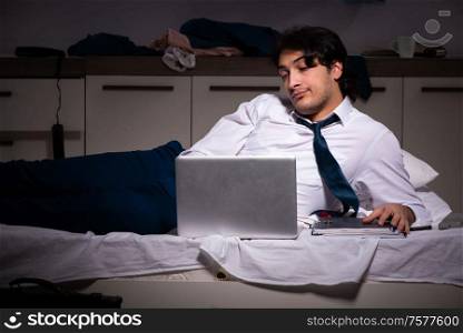 The young employee working at home after night shift. Young employee working at home after night shift