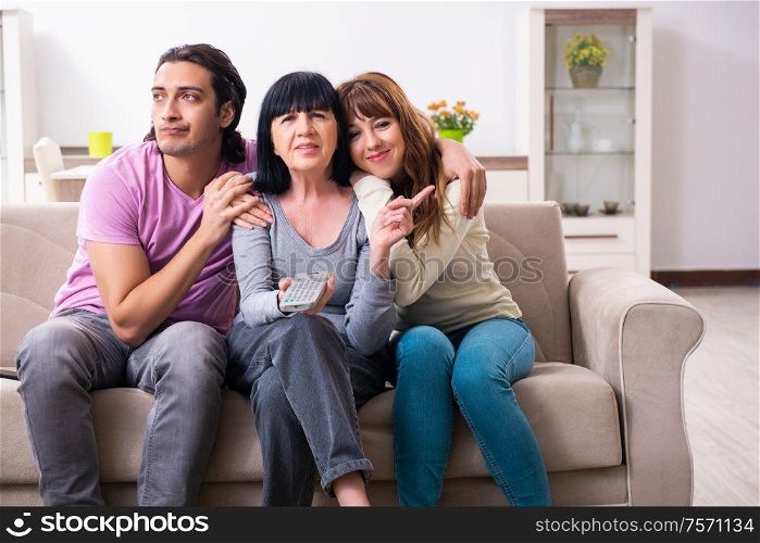 The young family and mother-in-law in family issues concept. Young family and mother-in-law in family issues concept