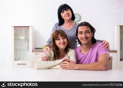 The young family and mother-in-law in family issues concept. Young family and mother-in-law in family issues concept