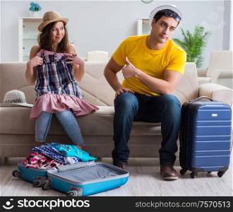 The young family preparing for travel vacation. Young family preparing for travel vacation
