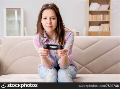 The young family suffering from computer games addiction. Young family suffering from computer games addiction