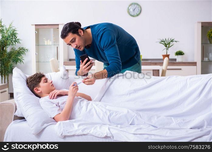 The young father caring for sick son. Young father caring for sick son