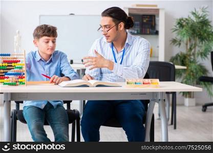 The young father helping his son to prepare for exam. Young father helping his son to prepare for exam