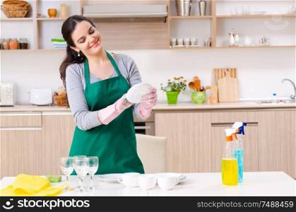 The young female contractor doing housework. Young female contractor doing housework