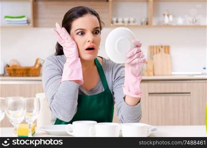 The young female contractor doing housework. Young female contractor doing housework