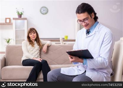 The young female patient discussing with male psychologist personal . Young female patient discussing with male psychologist personal