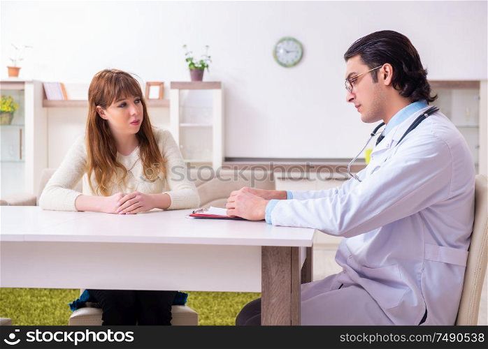The young female patient discussing with male psychologist personal. Young female patient discussing with male psychologist personal
