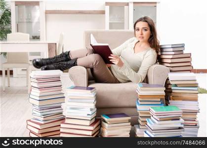 The young female student preparing for exams at home. Young female student preparing for exams at home