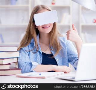 The young female student preparing for exams with vr glasses. Young female student preparing for exams with VR glasses