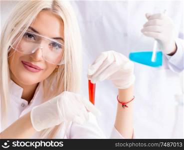 The young female woman doctor in hospital clinic lab. Young female woman doctor in hospital clinic lab
