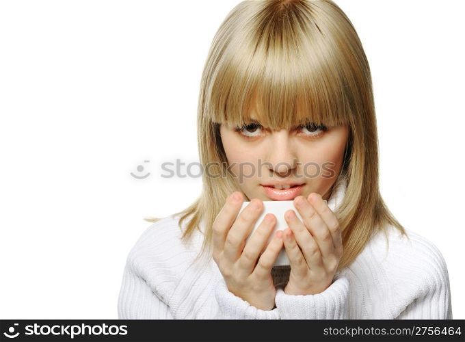 The young girl drinks coffee. A white cup, it is isolated on a white background