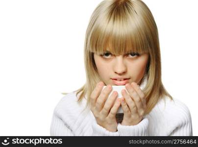 The young girl drinks coffee. A white cup, it is isolated on a white background