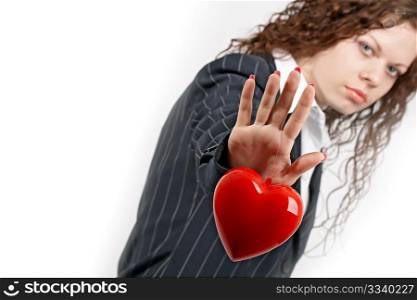 The young girl in a business suit holds heart