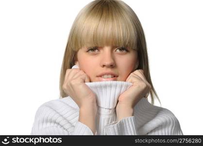 The young girl in a warm sweater. Feeling of a cold