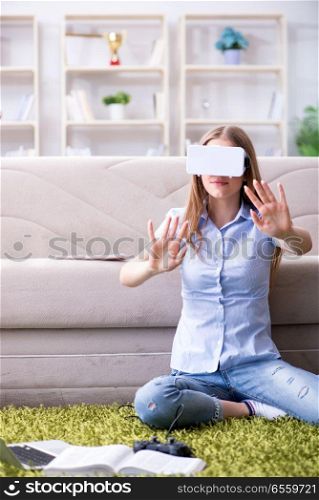 The young girl playing virtual reality games. Young girl playing virtual reality games