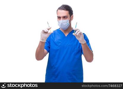 The young handsome doctor with syringe isolated on white . Young handsome doctor with syringe isolated on white 