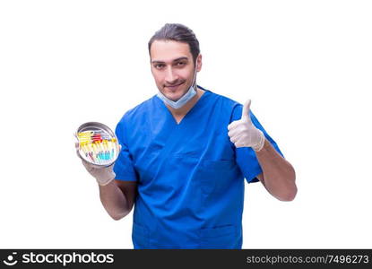 The young handsome doctor with syringe isolated on white. Young handsome doctor with syringe isolated on white