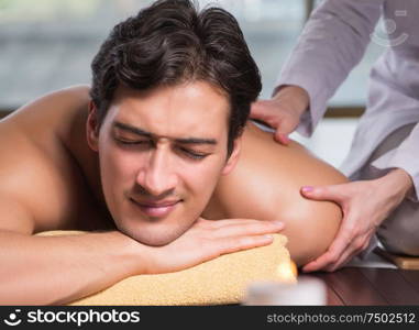 The young handsome man during spa procedure. Young handsome man during spa procedure