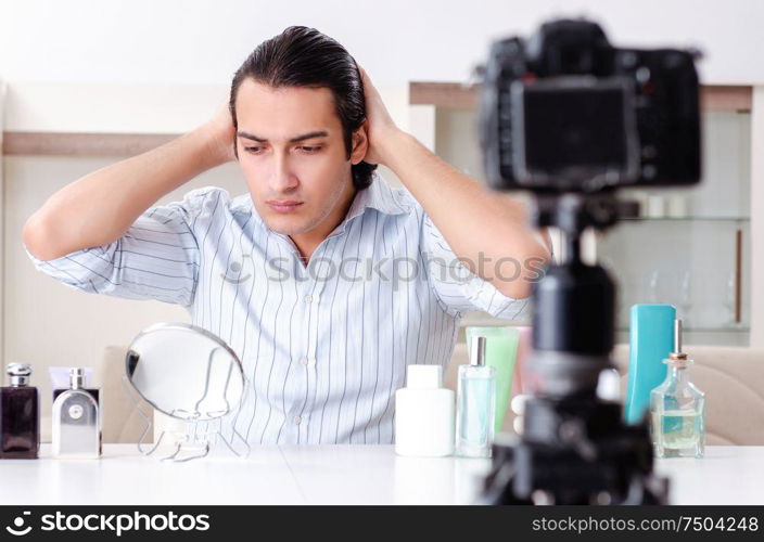 The young handsome man recording his blog in hygiene concept. Young handsome man recording his blog in hygiene concept