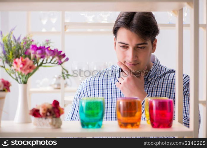 The young handsome man shopping in shop. Young handsome man shopping in shop