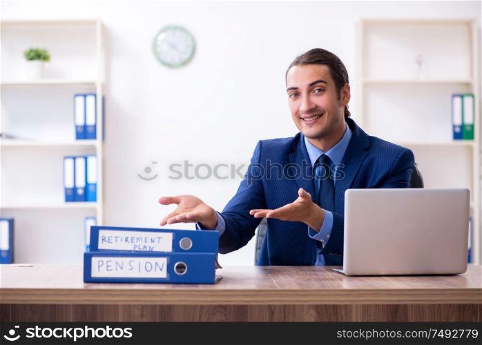 The young male accountant working in the office. Young male accountant working in the office