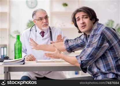 The young male alcoholic visiting old doctor . Young male alcoholic visiting old doctor