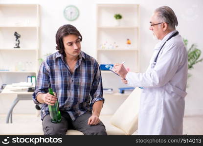 The young male alcoholic visiting old doctor. Young male alcoholic visiting old doctor