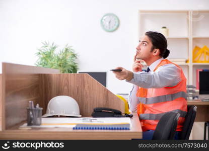 The young male architect working in the office. Young male architect working in the office