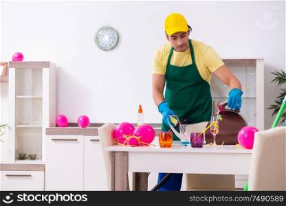 The young male contractor doing housework after party. Young male contractor doing housework after party