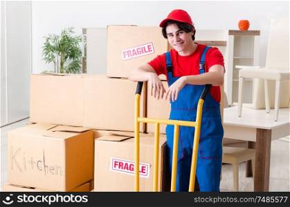 The young male contractor with boxes working indoors. Young male contractor with boxes working indoors
