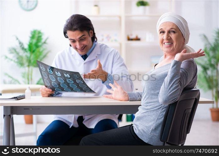 The young male doctor and female oncology patient . Young male doctor and female oncology patient 