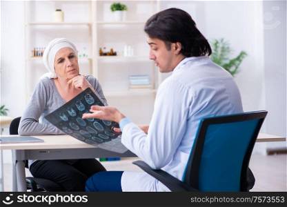 The young male doctor and female oncology patient. Young male doctor and female oncology patient
