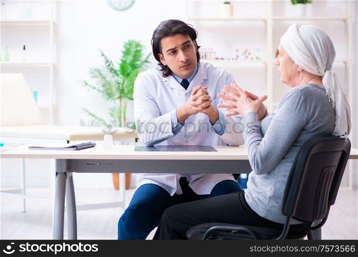 The young male doctor and female oncology patient. Young male doctor and female oncology patient