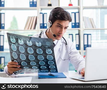 The young male doctor in telehealth concept. Young male doctor in telehealth concept