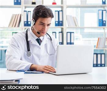 The young male doctor in telehealth concept. Young male doctor in telehealth concept