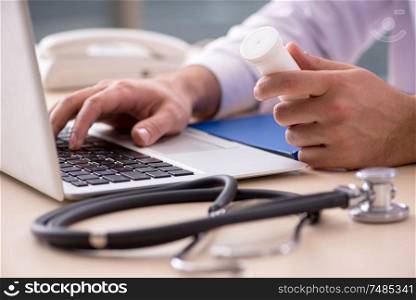 The young male doctor in telemedicine concept. Young male doctor in telemedicine concept