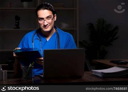 The young male doctor in the hospital at night . Young male doctor in the hospital at night 
