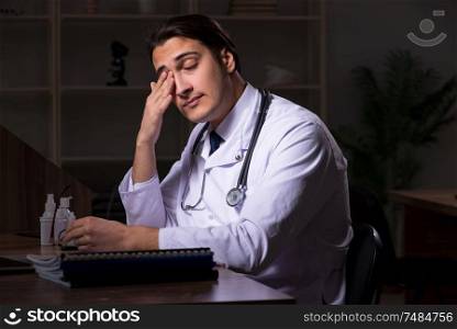The young male doctor in the hospital at night. Young male doctor in the hospital at night