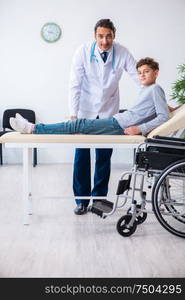 The young male doctor pediatrist and boy in wheel-chair. Young male doctor pediatrist and boy in wheel-chair