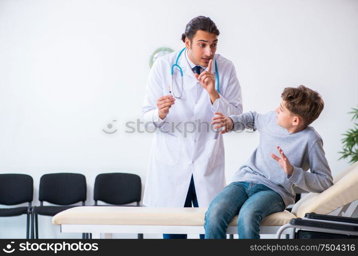 The young male doctor pediatrist and boy in wheel-chair. Young male doctor pediatrist and boy in wheel-chair