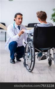 The young male doctor pediatrist and boy in wheel-chair. Young male doctor pediatrist and boy in wheel-chair
